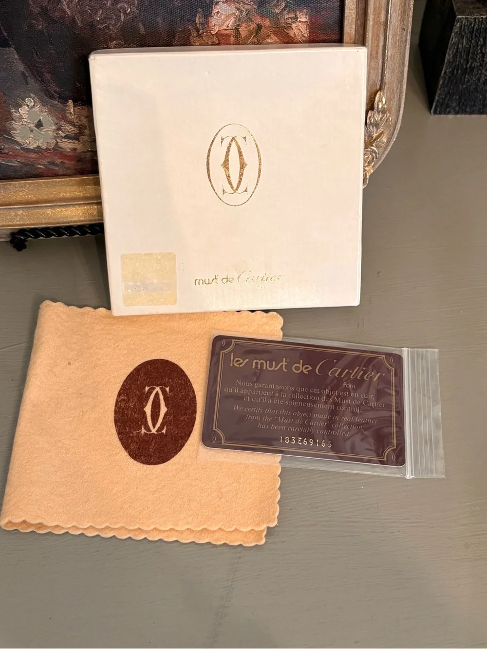 Cartier Burgundy Leather Men's Wallet with Gold Corner Accents